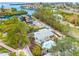 Aerial view of the house, pool, and neighborhood at 541 Edlee Ln, Longboat Key, FL 34228