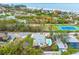 Aerial view showing home, pool, tennis court, and ocean at 541 Edlee Ln, Longboat Key, FL 34228