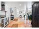 Stylish bar area with white cabinets, and a beverage cart at 541 Edlee Ln, Longboat Key, FL 34228