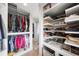 Organized walk-in closet with custom shelving and drawers at 541 Edlee Ln, Longboat Key, FL 34228