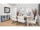 Bright dining room with a contemporary glass-top dining table at 541 Edlee Ln, Longboat Key, FL 34228