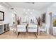 Elegant dining room featuring a glass-top table and white chairs at 541 Edlee Ln, Longboat Key, FL 34228