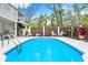 Private pool and patio area with tropical landscaping at 541 Edlee Ln, Longboat Key, FL 34228