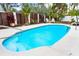 Inviting kidney-shaped pool with surrounding patio at 541 Edlee Ln, Longboat Key, FL 34228