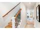 Stylish staircase with modern railing and ocean-themed steps at 541 Edlee Ln, Longboat Key, FL 34228