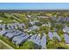 Aerial view of community with golf course and pool at 5532 Country Club Way, Sarasota, FL 34243