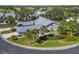 Aerial view of a house with landscaping and driveway at 5532 Country Club Way, Sarasota, FL 34243