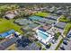 Aerial view of community tennis, pickleball courts and pool at 5532 Country Club Way, Sarasota, FL 34243