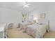 Cozy bedroom with twin beds and ample natural light at 5532 Country Club Way, Sarasota, FL 34243