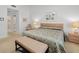 Main bedroom with king-size bed and access to bathroom at 5532 Country Club Way, Sarasota, FL 34243