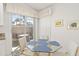 Cozy breakfast nook with glass table and chairs, overlooking a patio at 5532 Country Club Way, Sarasota, FL 34243