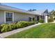 Exterior view of house with walkway and landscaping at 5532 Country Club Way, Sarasota, FL 34243