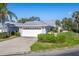 House exterior with a white garage door and driveway at 5532 Country Club Way, Sarasota, FL 34243