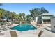 Refreshing community pool with plenty of lounge chairs at 5532 Country Club Way, Sarasota, FL 34243