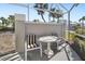 Relaxing screened patio with table and chairs, perfect for outdoor dining at 5532 Country Club Way, Sarasota, FL 34243