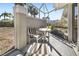 Enjoy this screened patio with seating and relaxing view at 5532 Country Club Way, Sarasota, FL 34243