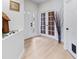 Bright and airy entryway with light wood flooring and French doors at 5715 Spanish Point Ct, Palmetto, FL 34221