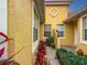 Front entrance with potted plants and a walkway leading to the door at 5715 Spanish Point Ct, Palmetto, FL 34221