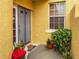 Front door with screen door and potted plants on either side at 5715 Spanish Point Ct, Palmetto, FL 34221