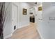 Light and bright hallway with wood-look floors at 5715 Spanish Point Ct, Palmetto, FL 34221