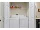 Convenient laundry room with washer and dryer in closet at 5715 Spanish Point Ct, Palmetto, FL 34221