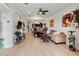 Bright living room featuring hardwood floors and a view into the kitchen at 5715 Spanish Point Ct, Palmetto, FL 34221