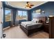 Main bedroom with large windows, ceiling fan, and wood floors at 5715 Spanish Point Ct, Palmetto, FL 34221