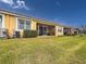 Back exterior showing screened porch and AC unit at 5715 Spanish Point Ct, Palmetto, FL 34221