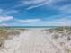 Beach access through the sand dunes at 5780 Midnight Pass Rd # 609, Sarasota, FL 34242