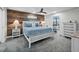 Beautiful bedroom with coastal decor and wood wall at 5780 Midnight Pass Rd # 609, Sarasota, FL 34242