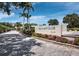 Landscaped entrance to the Gulf Bay Club with signage at 5780 Midnight Pass Rd # 609, Sarasota, FL 34242