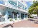 Two-story commercial building with storefront and holiday decor at 5780 Midnight Pass Rd # 609, Sarasota, FL 34242