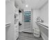 Bright laundry room with shelving and ample storage at 5780 Midnight Pass Rd # 609, Sarasota, FL 34242