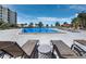 Resort-style pool with multiple lounge chairs at 5780 Midnight Pass Rd # 609, Sarasota, FL 34242