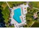 Aerial view of Gulf Bay Club's unique shaped pool and surrounding lounge area at 5780 Midnight Pass Rd # 609, Sarasota, FL 34242