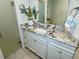 Bathroom features a granite countertop, modern vanity, and updated fixtures at 6101 34Th W St # 28B, Bradenton, FL 34210