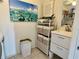 Laundry room with stacked washer and dryer and extra storage cabinets at 6101 34Th W St # 28B, Bradenton, FL 34210