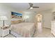 Bright main bedroom with king bed and access to the patio at 6101 34Th W St # 28B, Bradenton, FL 34210