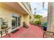 Outdoor patio with seating area and adjacent tropical landscaping at 6101 34Th W St # 28B, Bradenton, FL 34210