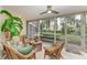 Relaxing sunroom with wicker furniture and lush greenery at 6101 34Th W St # 28B, Bradenton, FL 34210