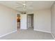 Spacious bedroom with carpet and an adjacent hallway at 618 Bird Bay S Dr # 206, Venice, FL 34285