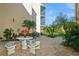 Community patio with seating and landscaping at 618 Bird Bay S Dr # 206, Venice, FL 34285