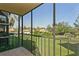 Screened balcony overlooking a lush green lawn and other buildings at 618 Bird Bay S Dr # 206, Venice, FL 34285