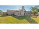 House exterior and backyard with grassy lawn at 6556 Waterford Cir, Sarasota, FL 34238