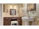 Charming bathroom with pedestal sink and vanity area at 6556 Waterford Cir, Sarasota, FL 34238