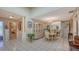 Bright dining area with chandelier and access to other rooms at 6556 Waterford Cir, Sarasota, FL 34238