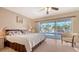 Main bedroom with sliding doors opening to a view of the pool at 6556 Waterford Cir, Sarasota, FL 34238