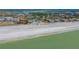 Aerial view of community near beach with tennis courts at 6750 Gulf Of Mexico Dr # 153, Longboat Key, FL 34228