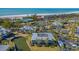 Aerial view of waterfront property with tennis courts and beach access at 6750 Gulf Of Mexico Dr # 153, Longboat Key, FL 34228