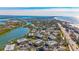 Aerial view of waterfront community with lush landscaping and private boat docks at 6750 Gulf Of Mexico Dr # 153, Longboat Key, FL 34228